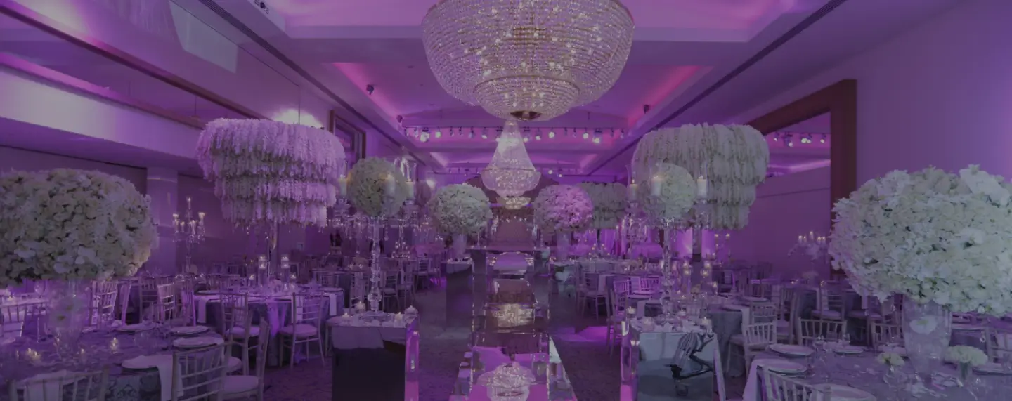 The Infinity Suite with chandeliers and tall centrepieces at Meridian Grand — private suite venue London.