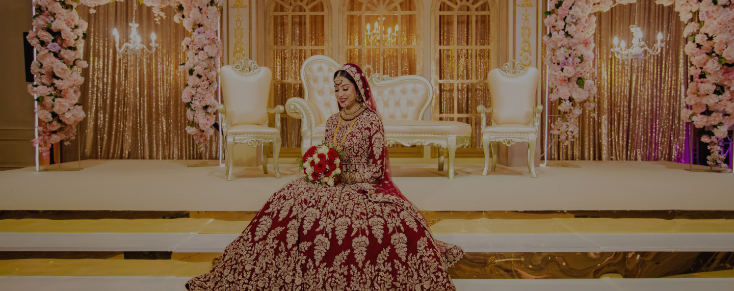 Bengali bride on the ceremony stage at Meridian Grand — Bengali wedding venue London.