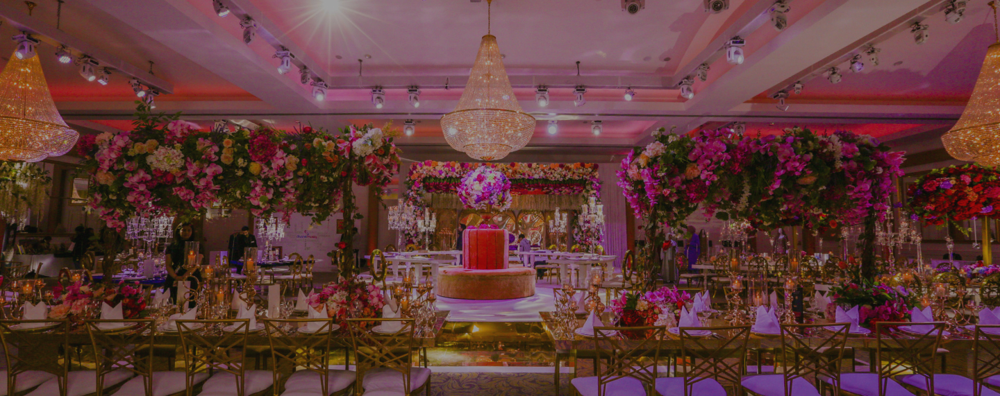 Meridian Grand Ballroom with florals and a tiered cake at Meridian Grand — Meridian Grand Ballroom venue London.